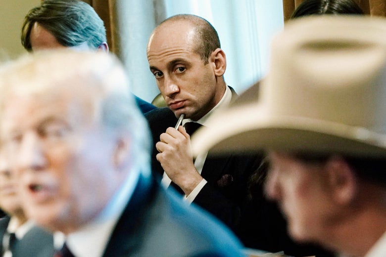 Stephen Miller listening to Donald Trump